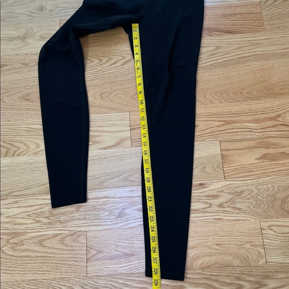 ALO Yoga black ripped high waist warrior leggings.